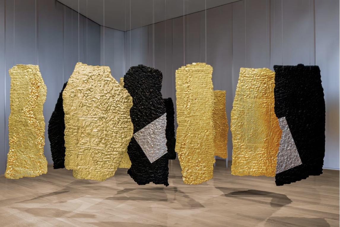 Installation view of hanging textile artworks by Colombian artist Olga de Amaral.